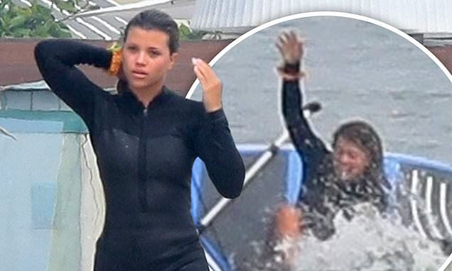 Sofia Richie dons a short wetsuit as she wipes out while paddleboarding…after Scott Disick split – Daily Mail