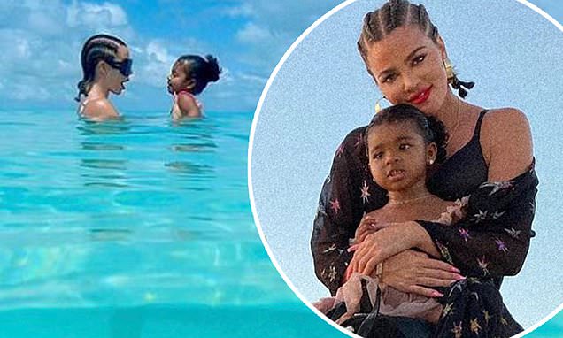 Khloe Kardashian takes a dip with daughter True in gorgeous blue waters during tropical vacation – Daily Mail