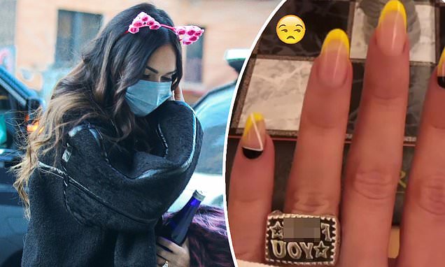 Megan Fox seemingly shuts down Machine Gun Kelly engagement rumors by modeling a VERY vulgar ring – Daily Mail