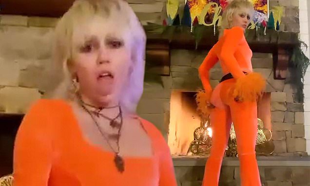 Miley Cyrus slips into a skintight orange get-up and declares: NEW YEAR. SAME ME on Instagram – Daily Mail