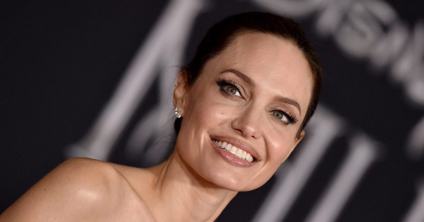 Angelina Jolie Brought Back the Pajama Trend in a Silky Striped Jumpsuit – InStyle