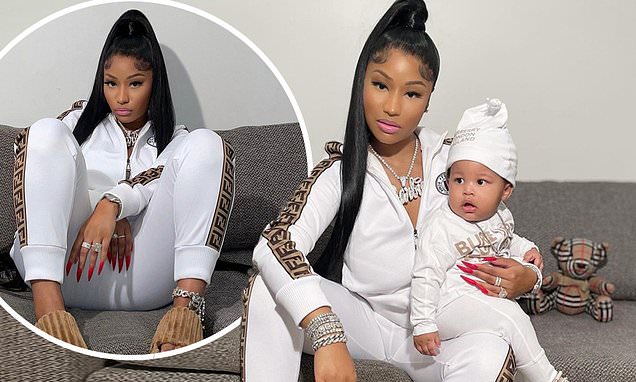 Nicki Minaj cradles nine-month-old son Papa Bear as the duo sport matching designer tracksuits – Daily Mail