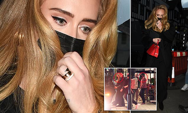 Adele sports a band on her wedding finger leaving a studio in London – Daily Mail