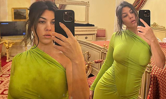 Kourtney Kardashian goes braless in a green figure-hugging dress in snaps from her romantic getaway – Daily Mail